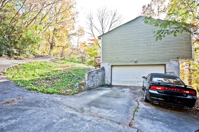 view of side of property featuring a garage