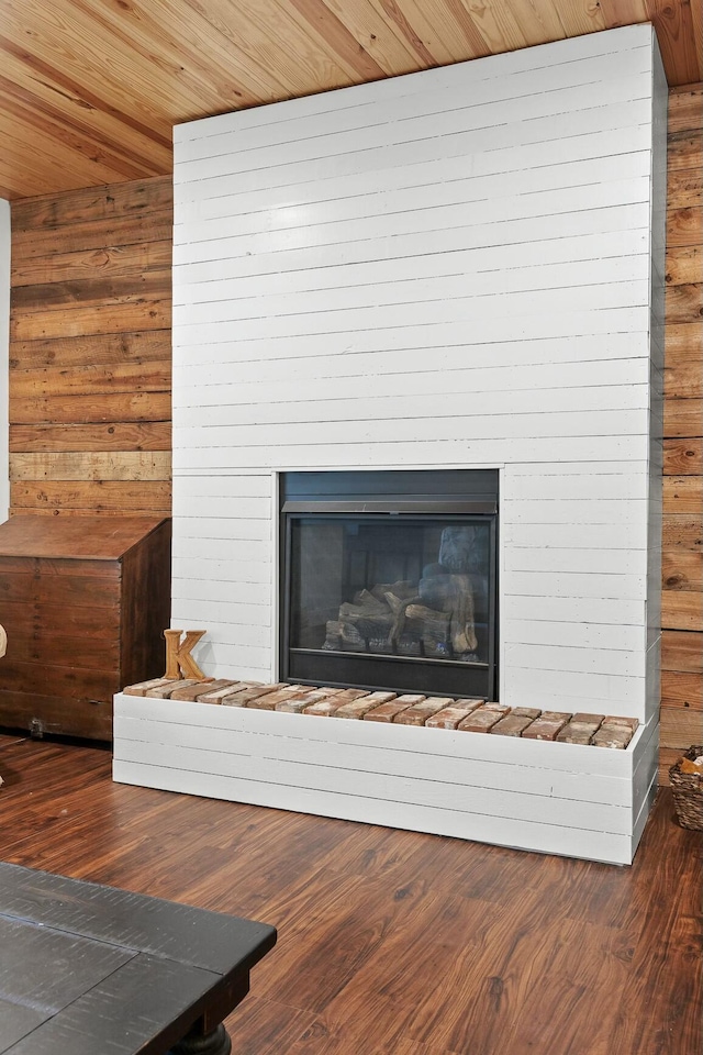 room details featuring hardwood / wood-style flooring, wood ceiling, and wooden walls