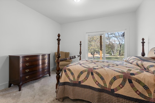 bedroom featuring light colored carpet