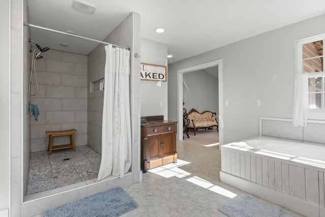 bathroom featuring separate shower and tub