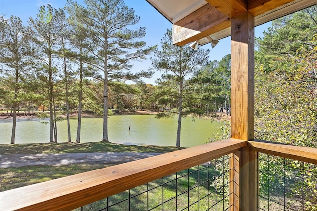 wooden deck with a water view