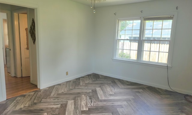 empty room with dark parquet floors