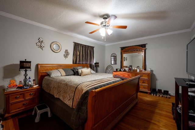 bedroom featuring a textured ceiling, crown molding, ceiling fan, and dark wood-type flooring