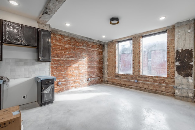 interior space featuring brick wall