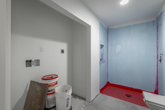 bathroom with concrete flooring