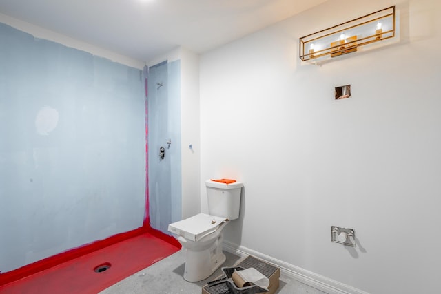 bathroom featuring toilet and concrete floors