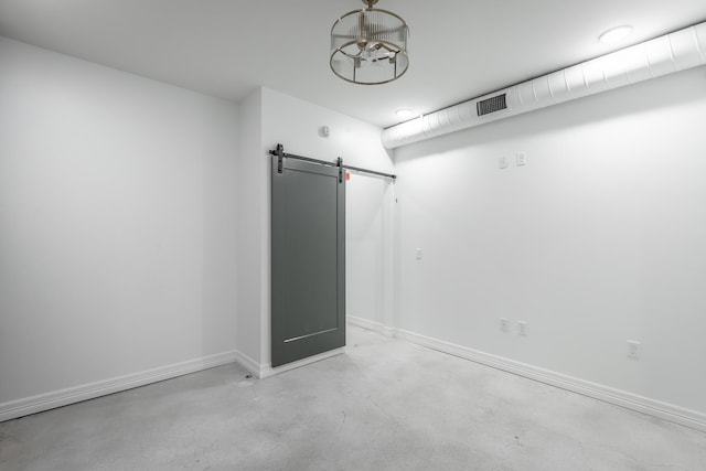 empty room featuring a barn door