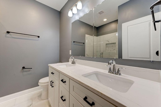 bathroom featuring vanity, an enclosed shower, and toilet