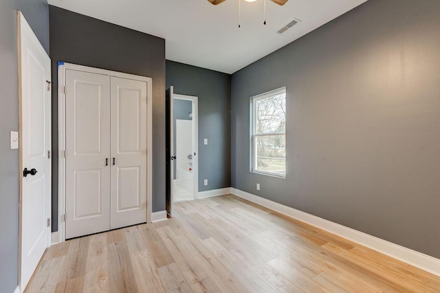 unfurnished bedroom featuring ceiling fan and light hardwood / wood-style flooring