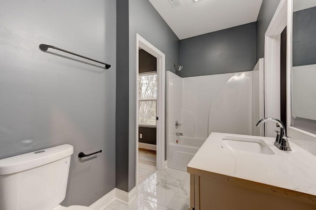 full bathroom featuring vanity,  shower combination, and toilet