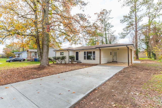 ranch-style home with a carport