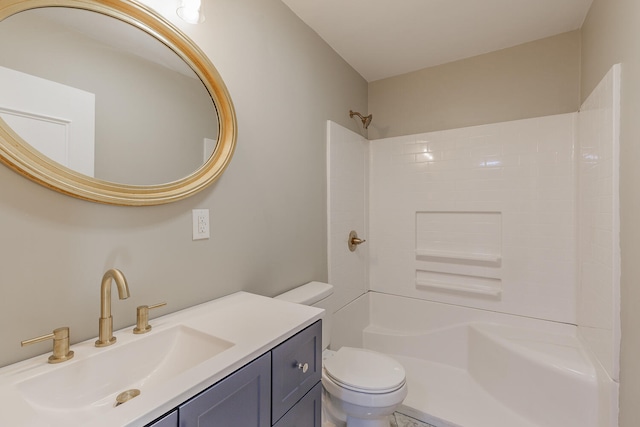 bathroom featuring vanity, toilet, and walk in shower