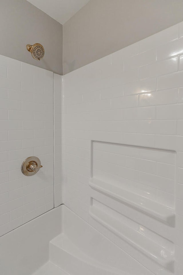 bathroom with tiled shower