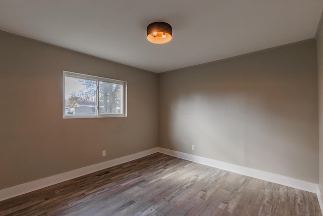 empty room featuring hardwood / wood-style flooring