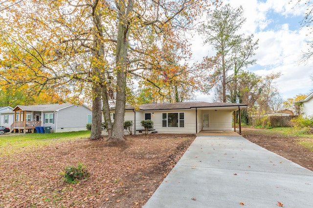 single story home featuring a carport