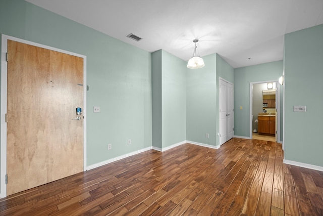 spare room featuring hardwood / wood-style floors