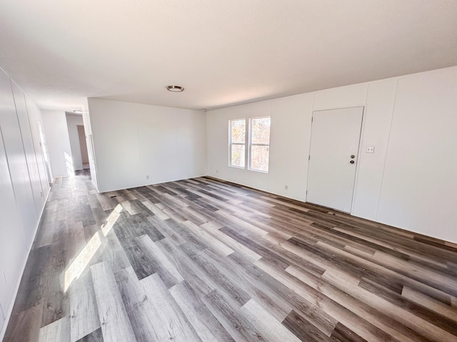 unfurnished room with hardwood / wood-style floors