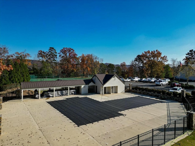 view of pool featuring a carport