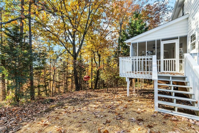 view of yard with a sunroom