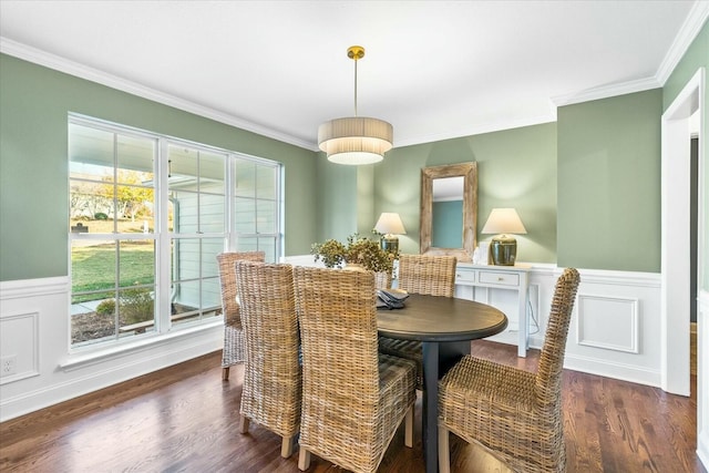 dining space featuring dark hardwood / wood-style flooring and ornamental molding