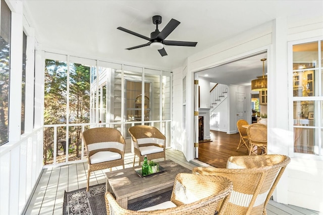 sunroom with plenty of natural light and ceiling fan