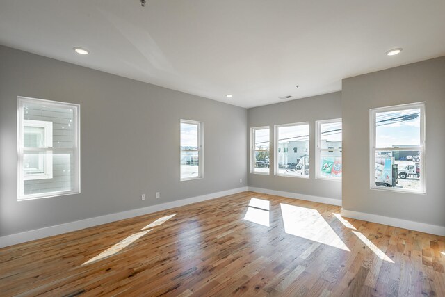 spare room with light wood-type flooring