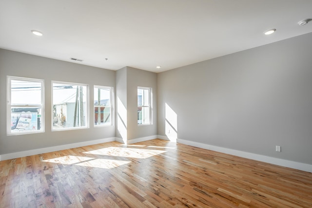 unfurnished room with light wood-type flooring