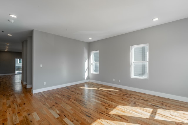 unfurnished room with light hardwood / wood-style flooring