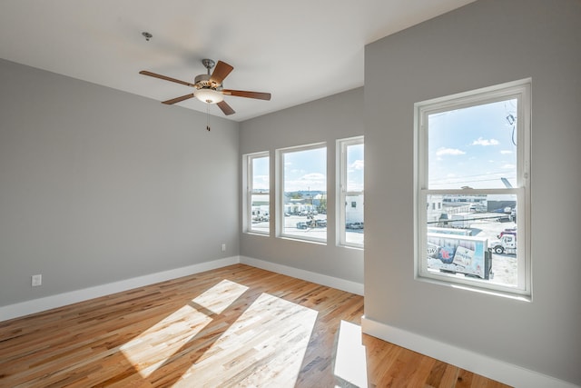 empty room featuring light hardwood / wood-style floors and ceiling fan