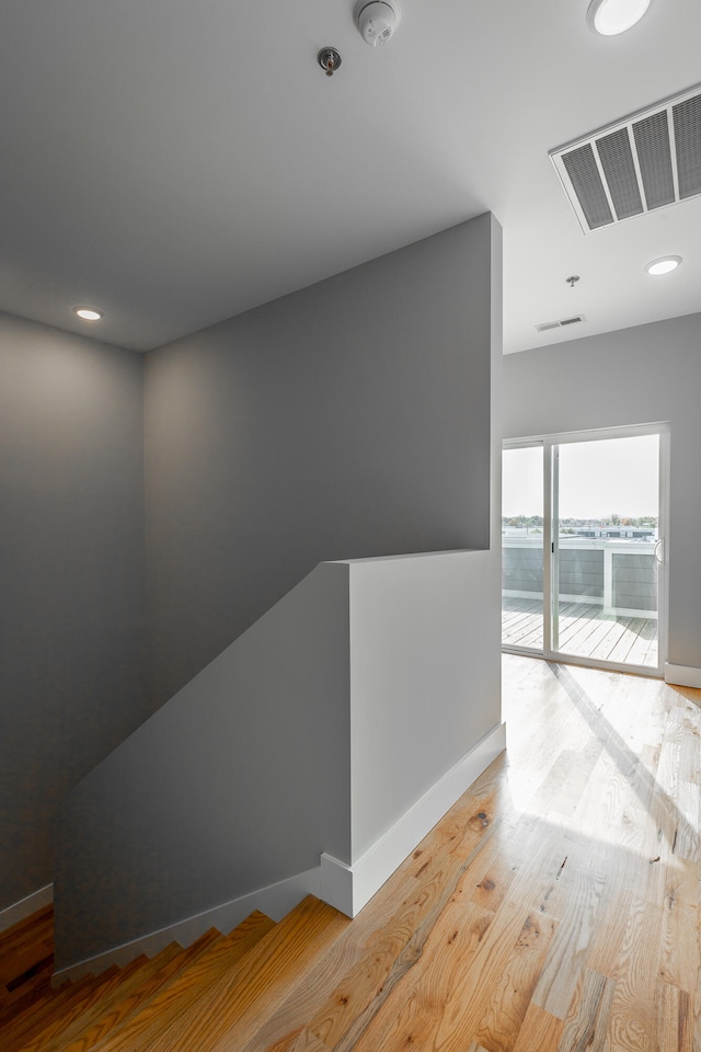 hallway featuring light hardwood / wood-style flooring