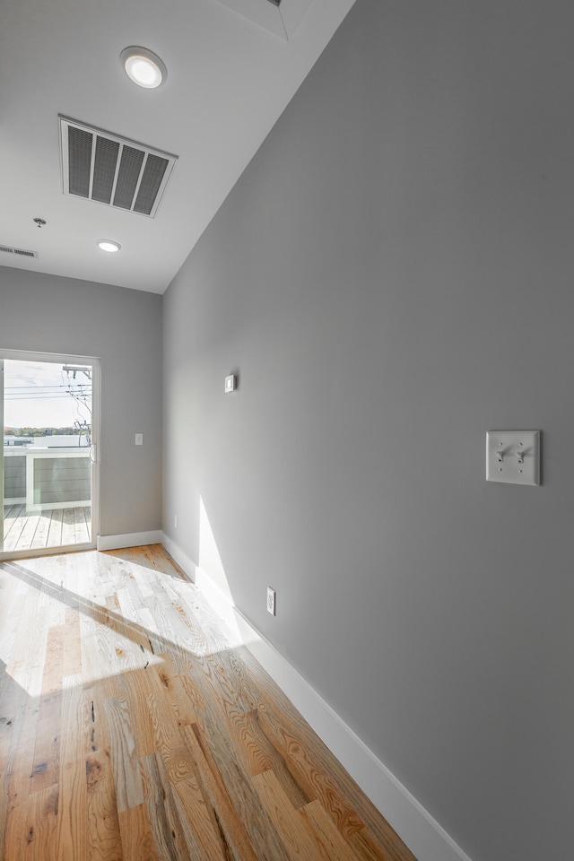 spare room with light wood-type flooring