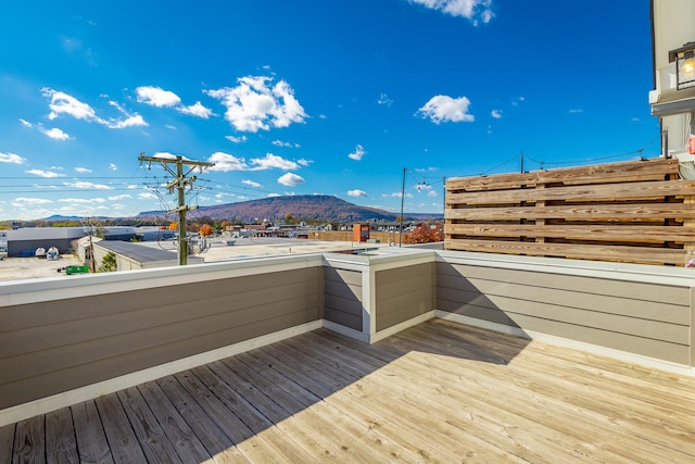 wooden deck with a mountain view