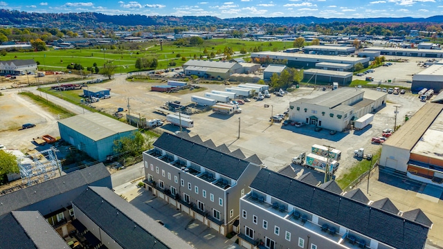 birds eye view of property with a mountain view