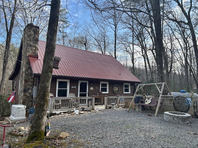 view of front facade with an outdoor fire pit