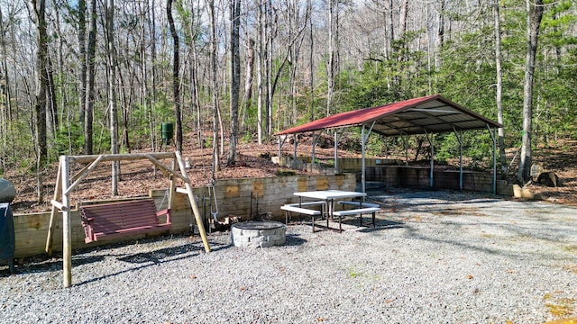 view of yard with a gazebo and a fire pit