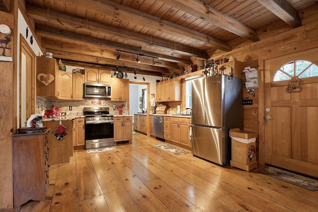 kitchen with appliances with stainless steel finishes, tasteful backsplash, beamed ceiling, wood ceiling, and light wood-type flooring