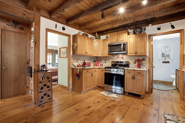 kitchen with backsplash, light hardwood / wood-style flooring, wooden ceiling, and appliances with stainless steel finishes