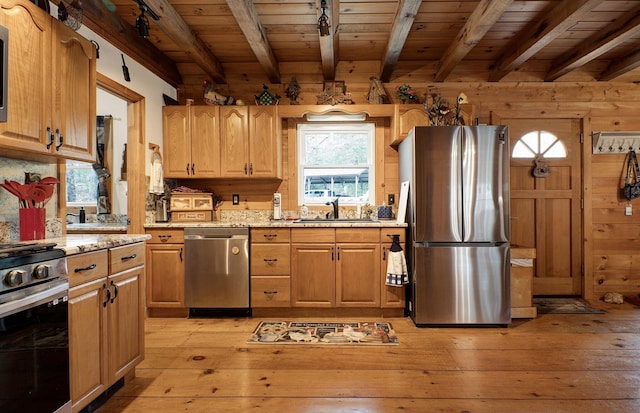 kitchen featuring stainless steel appliances, wooden ceiling, light stone counters, and light hardwood / wood-style flooring