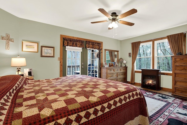 bedroom featuring access to exterior, french doors, and ceiling fan