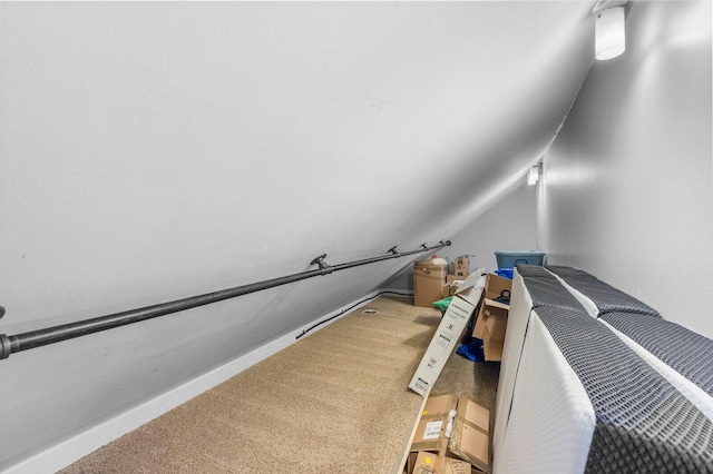 spacious closet with carpet and vaulted ceiling