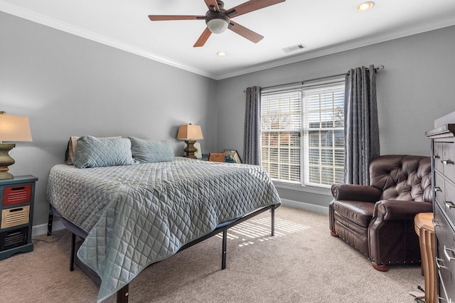 bedroom featuring ceiling fan, crown molding, and light carpet