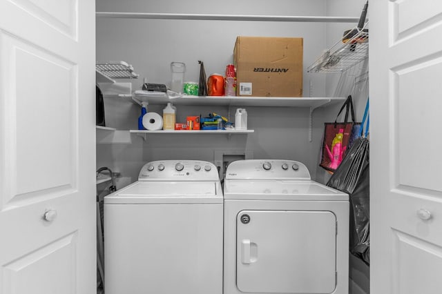 laundry room featuring washer and clothes dryer