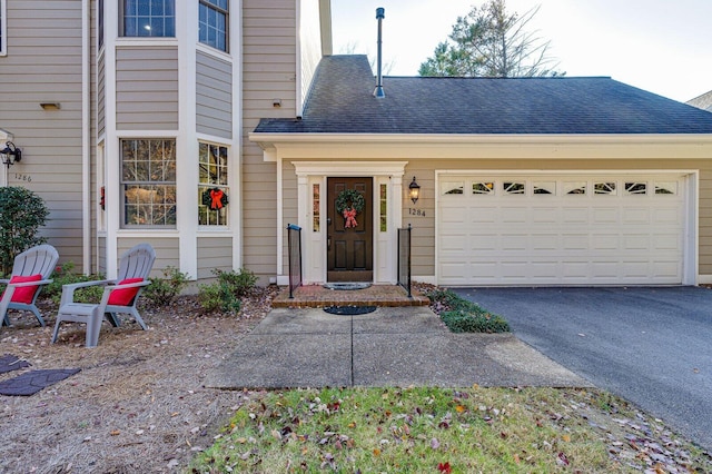 view of front of property featuring a garage