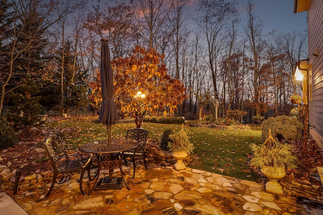 patio terrace at dusk with a lawn