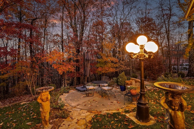 view of patio terrace at dusk