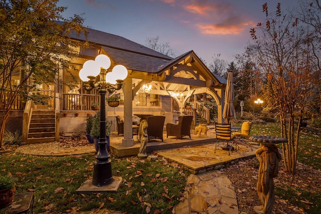 view of patio terrace at dusk