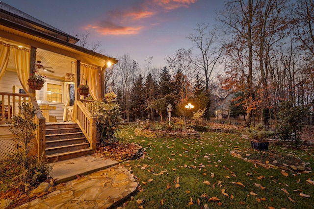 view of yard at dusk