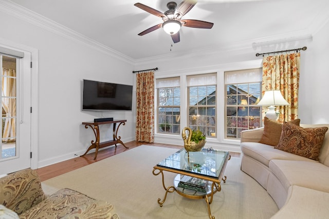 living room featuring crown molding, ceiling fan, and wood-type flooring