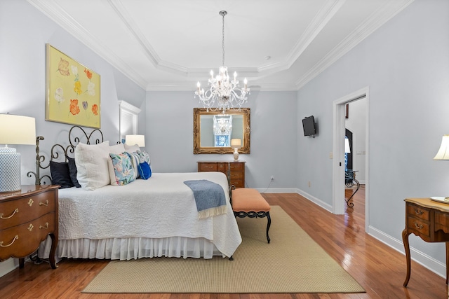 bedroom with wood-type flooring, crown molding, and an inviting chandelier