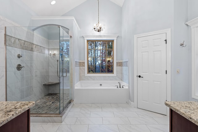 bathroom with high vaulted ceiling, vanity, a chandelier, and shower with separate bathtub